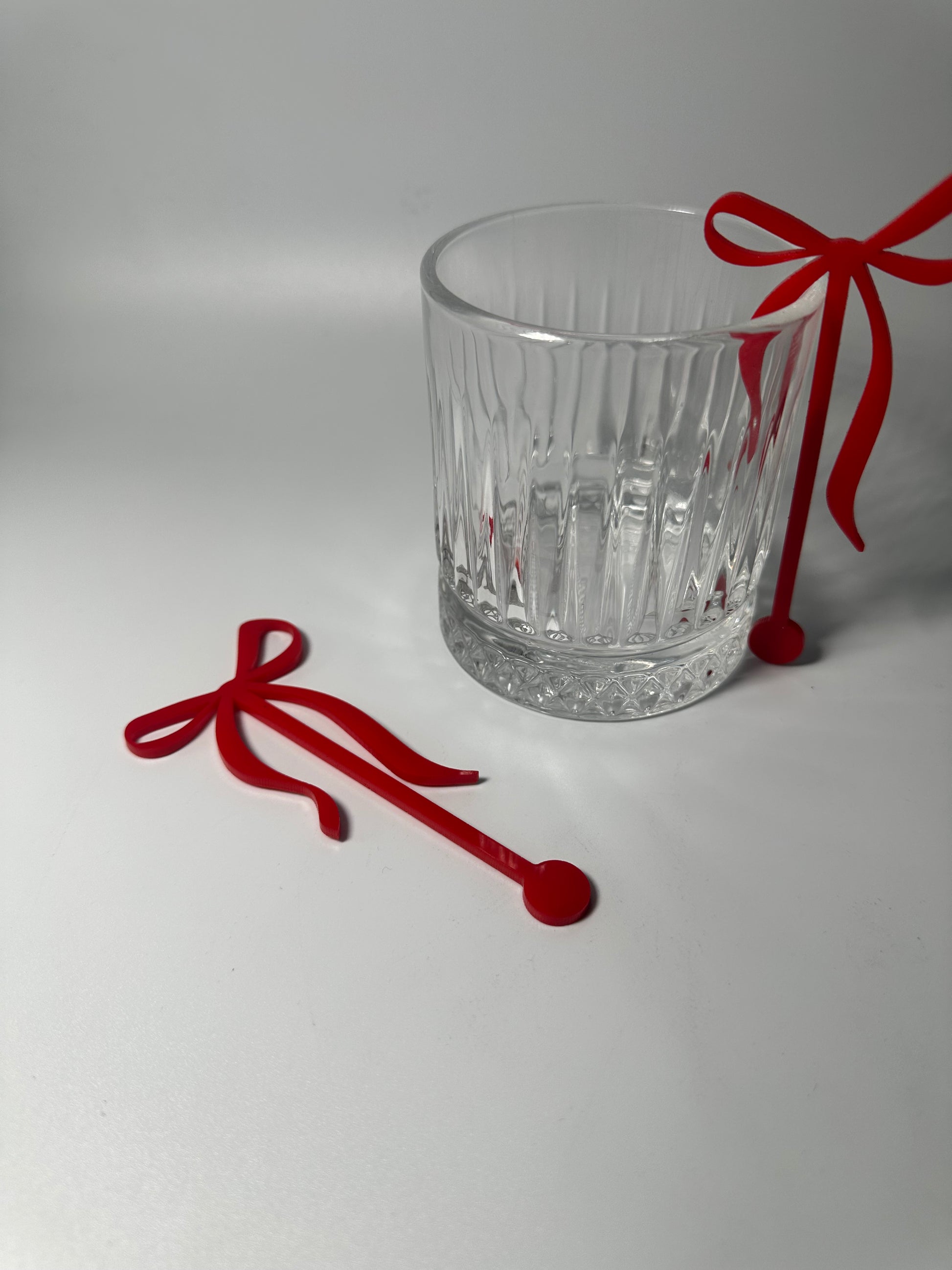 Acrylic bow stirrers, drink stirrers for party, party decor, a tini bit older, party ideas, elegant party decor, bachelorette party decor, classy drink stirrers, how to upgrade a party, instant party upgrades, easy party decor, baby shower decor, anniversary, martini party themed decor, Atlanta party decor, party favors, girl dinner ideas, coquette themed birthday, baby shower decor, red bow drink stirrers, red party decor