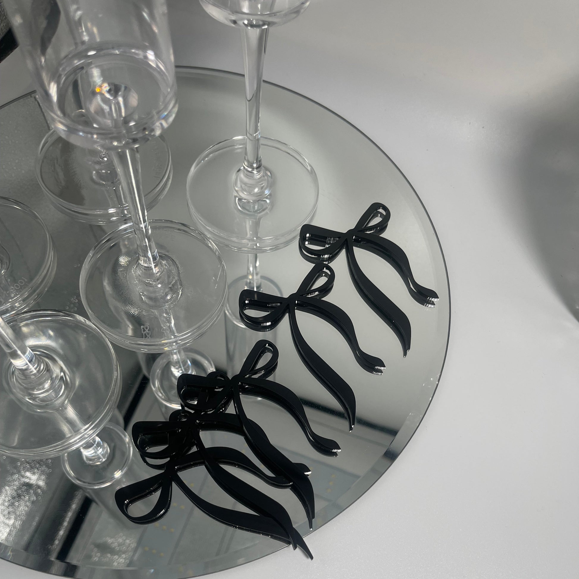 bow drink tags, bow decor, black bow party decor, party decor, a tini bit older decor, acrylic bow drink tags, drink tags for parties, graduation season, party favors, bachelorette party decor, birthday party decor, black bow decor, black party decor, coquette themed decor, part ideas, cutesy party ideas 