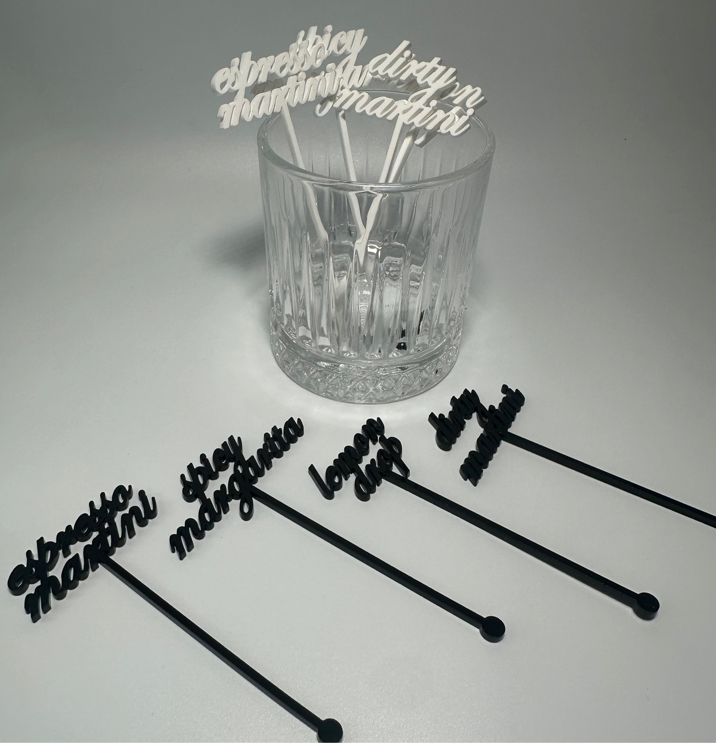 drink name stirrers, party decor, custom acrylic drink stirrers white drink stirrers with espresso martini cut out, espresso martini drink stirrers, martini themed party decor, martini themed party, classy drink decor, drink accessories, drink tags, martini party, minimalist party decor, party vendor atlanta, party vendor miami, acrylic sign vendor, swizzle sticks, mobile bartender set up, mobile bartender must haves, elevate your bar set up
