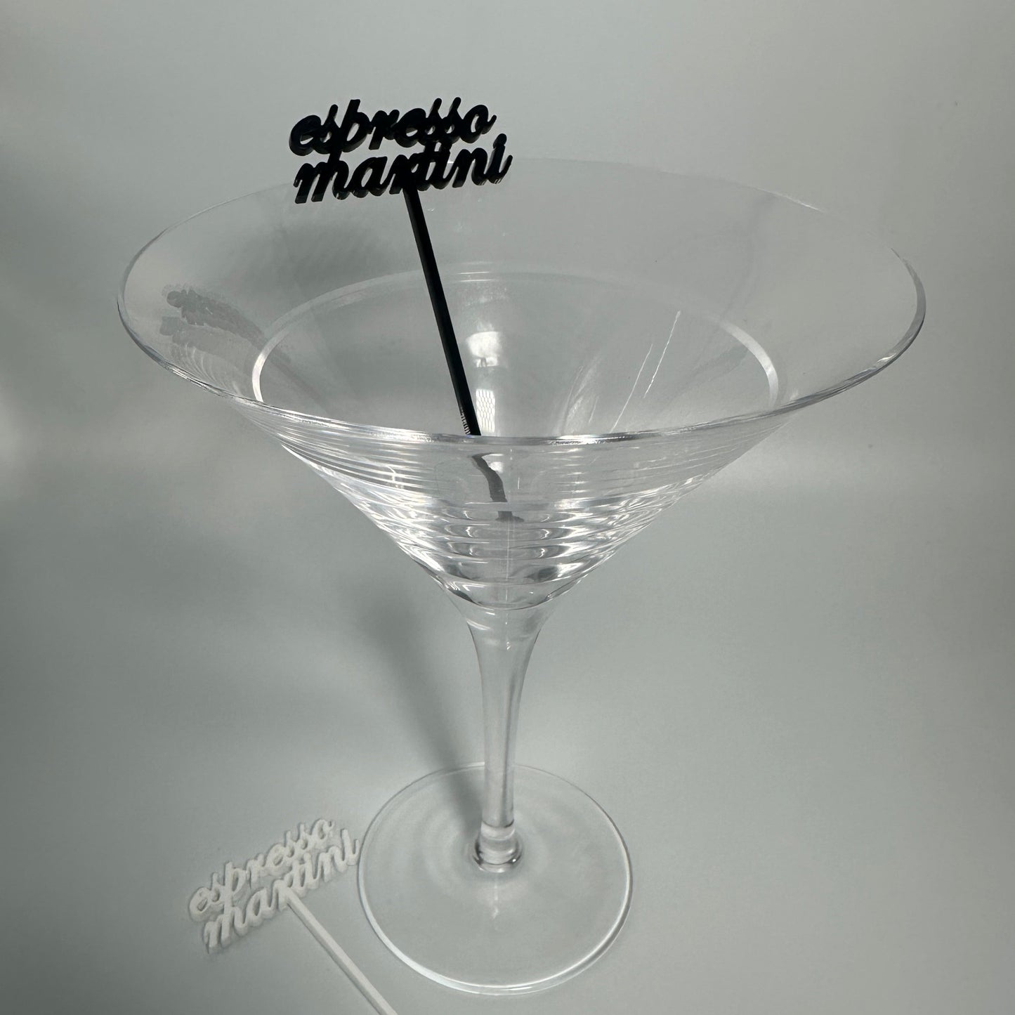 drink name stirrers, party decor, custom acrylic drink stirrers white drink stirrers with espresso martini cut out, espresso martini drink stirrers, martini themed party decor, martini themed party, classy drink decor, drink accessories, drink tags, martini party, minimalist party decor, party vendor atlanta, party vendor miami, acrylic sign vendor, swizzle sticks, mobile bartender set up, mobile bartender must haves, elevate your bar set up