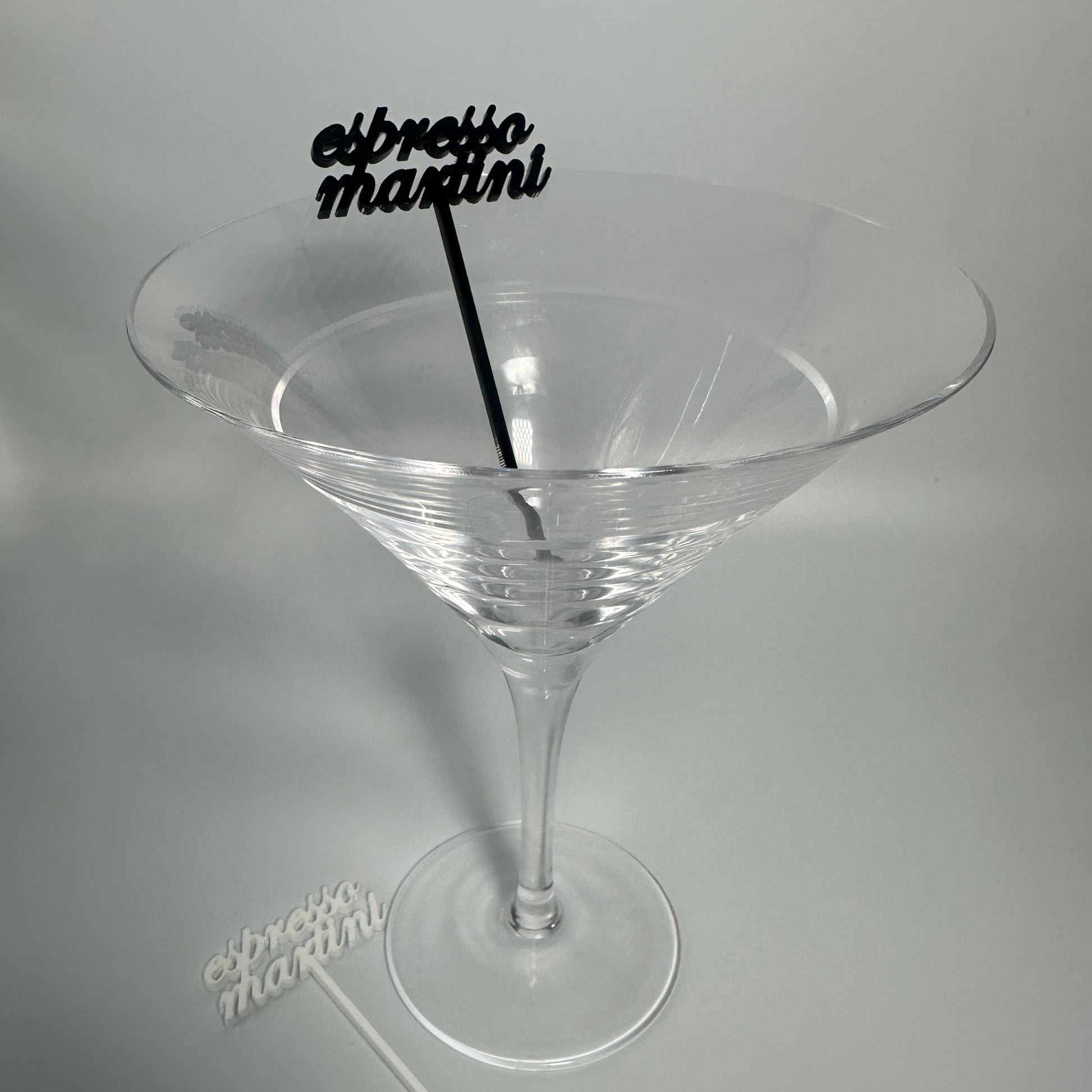drink name stirrers, party decor, custom acrylic drink stirrers white drink stirrers with espresso martini cut out, espresso martini drink stirrers, martini themed party decor, martini themed party, classy drink decor, drink accessories, drink tags, martini party, minimalist party decor, party vendor atlanta, party vendor miami, acrylic sign vendor, swizzle sticks, mobile bartender set up, mobile bartender must haves, elevate your bar set up