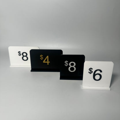 white retail display labels, acrylic retail labels, mini price signs for boutiques, boutique price labels, custom pricing signs, lioness engraving signs, lioness engraving, store set up essentials, black retail display labels, reusable sale signage, opening up a store, bakery retail sign, 