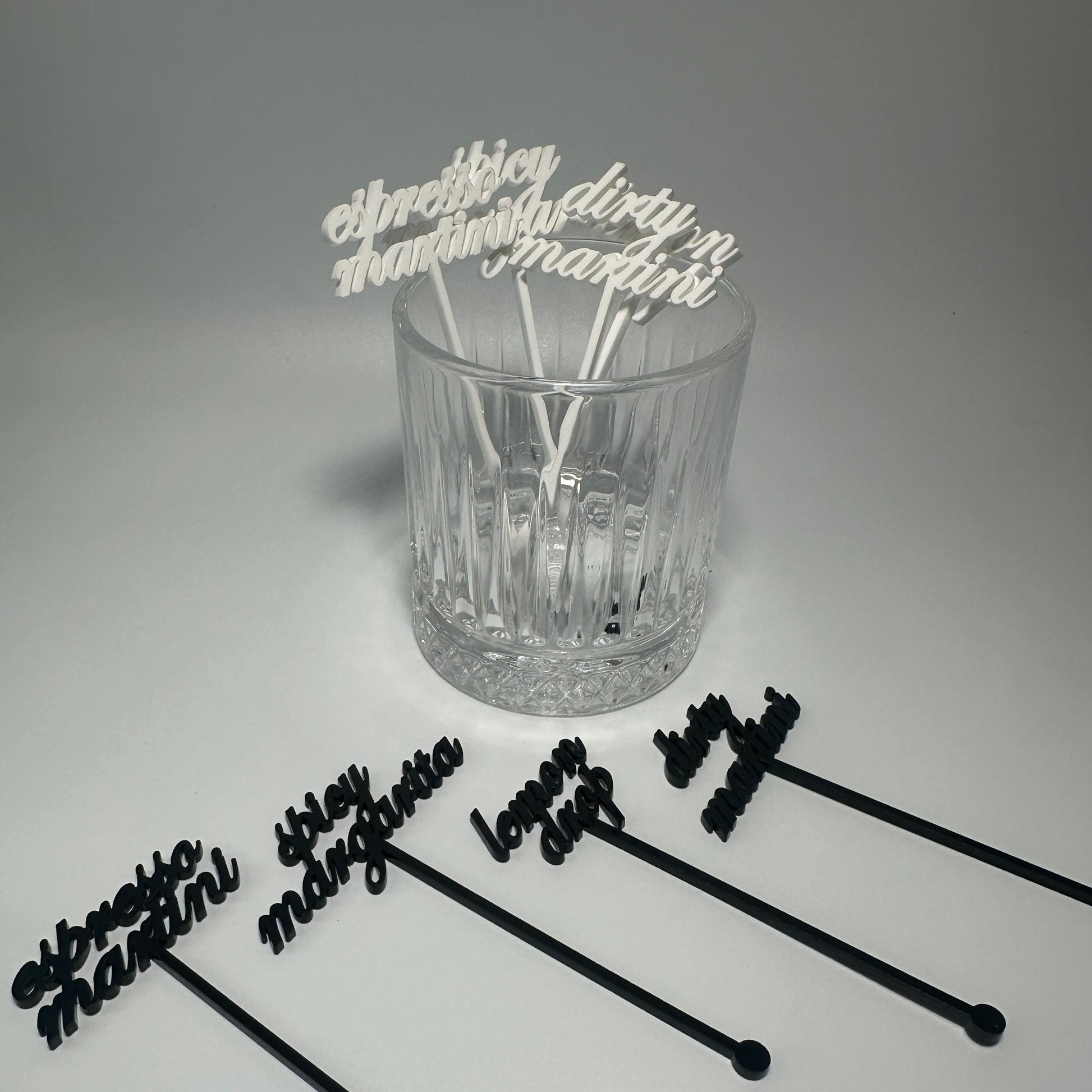 drink name stirrers, party decor, custom acrylic drink stirrers white drink stirrers with espresso martini cut out, espresso martini drink stirrers, martini themed party decor, martini themed party, classy drink decor, drink accessories, drink tags, martini party, minimalist party decor, party vendor atlanta, party vendor miami, acrylic sign vendor, swizzle sticks, mobile bartender set up, mobile bartender must haves, elevate your bar set up, martini stirrers for party