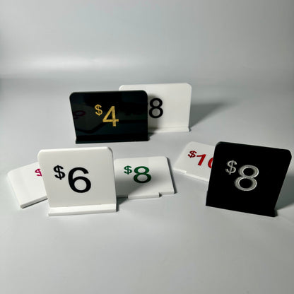 white retail display labels, acrylic retail labels, mini price signs for boutiques, boutique price labels, custom pricing signs, lioness engraving signs, lioness engraving, store set up essentials, black retail display labels, reusable sale signage, opening up a store, bakery retail sign, 